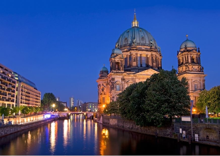 berlin dome after sunset on river