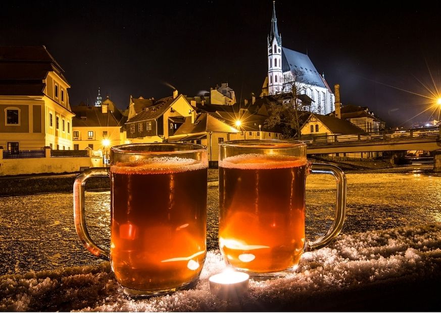 two mugs of beer in winter in prague